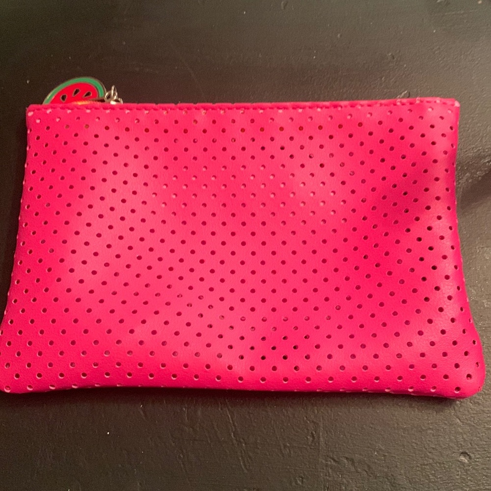 A makeup bag and hand gel